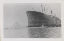 workers around a large ship