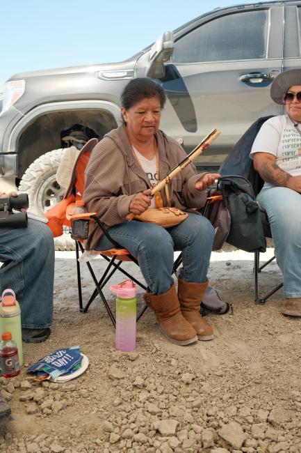 Elder Teresa performs a song.