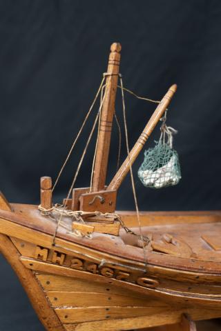 Boat model, bait and anchor