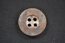 Button from prisoner's clothing